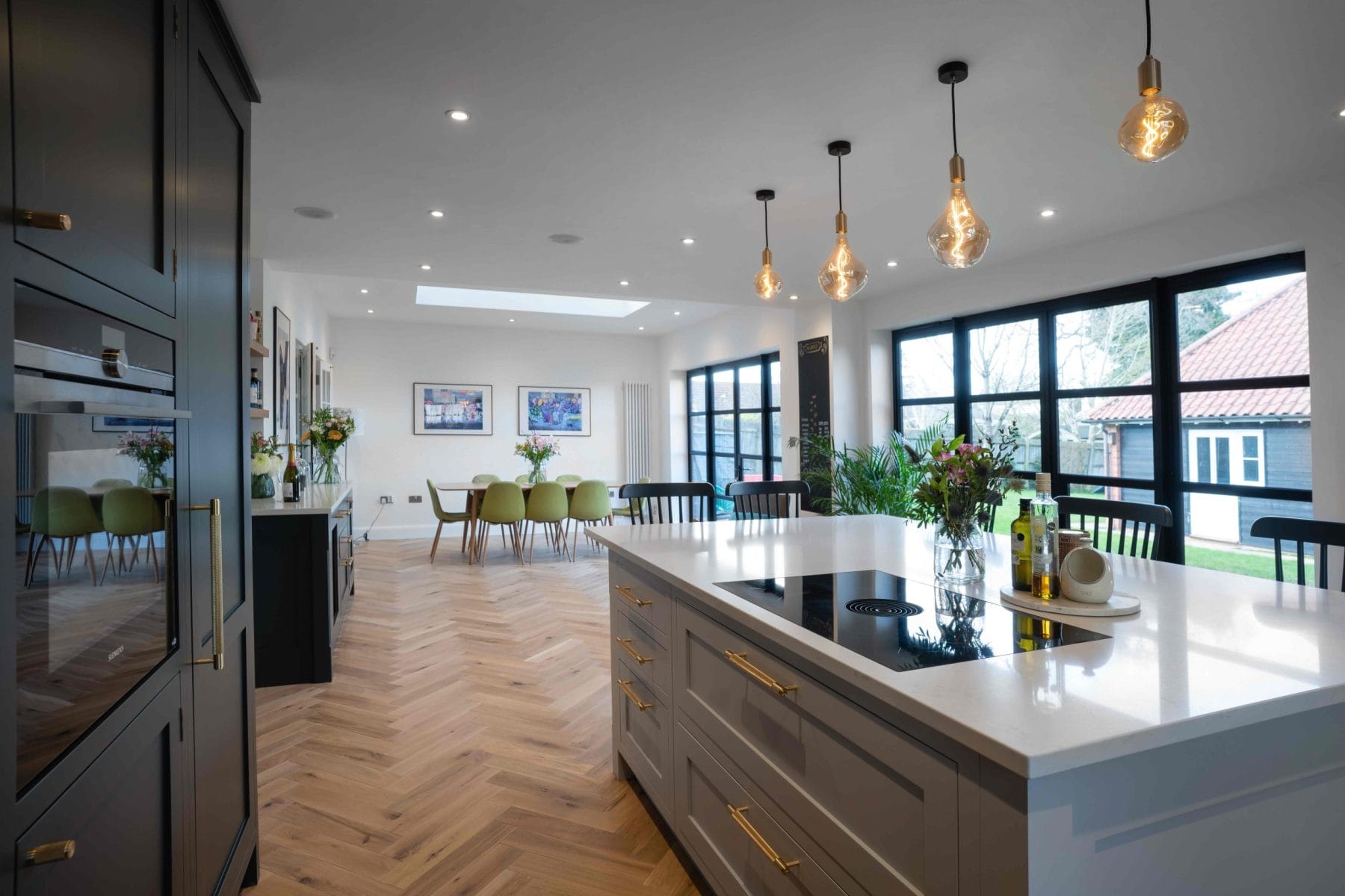 CUSTOM DARK SHAKER KITCHEN WITH OAK PARQUET FLOORING