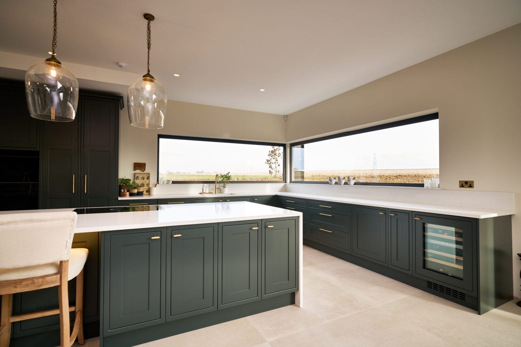 Traditional Kitchen with white worktops and wide windows