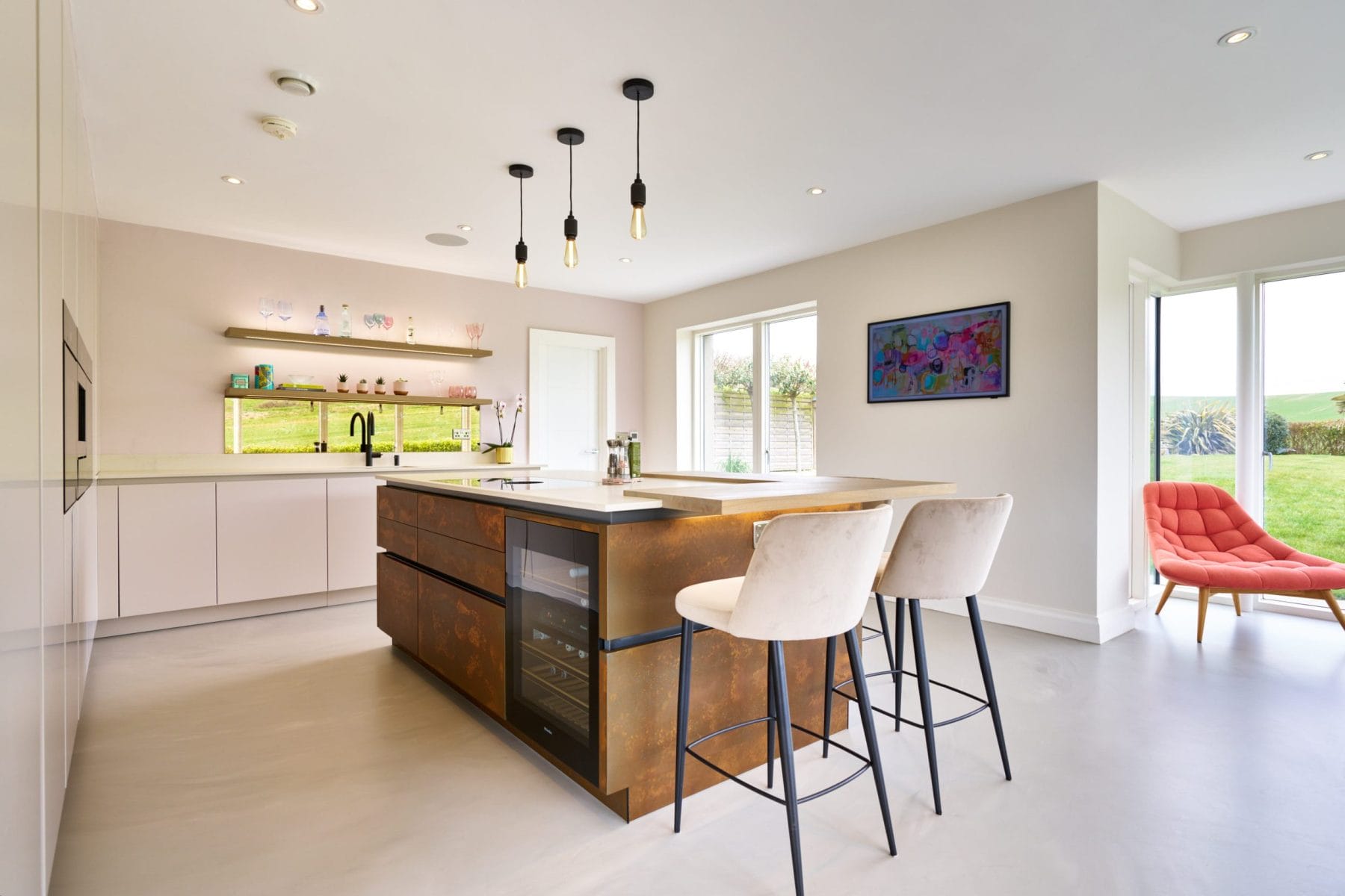 Kitchen design with Resin Cement Floor and Copper Feature Island.