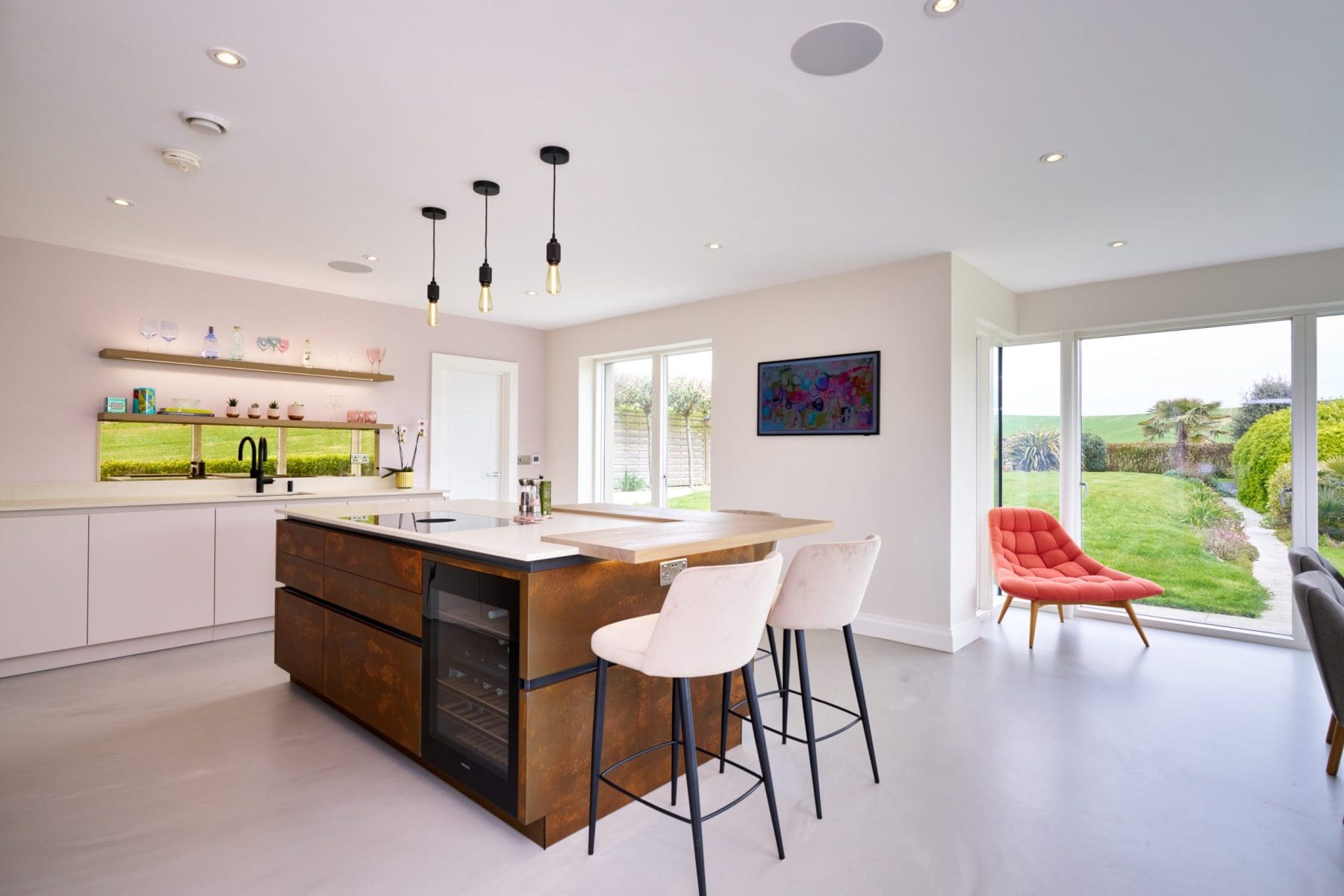 Kitchen design with Resin Cement Floor and Copper Feature Island.