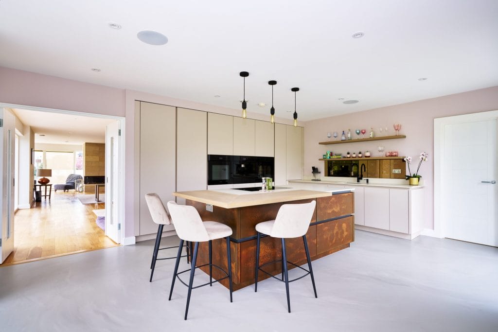 Kitchen design with Resin Cement Floor and Copper Feature Island.