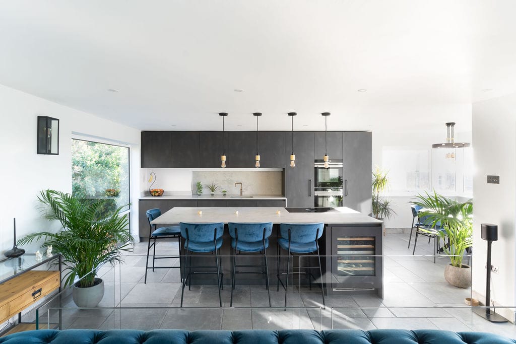 Dark Grey modern kitchen with blue bar stools