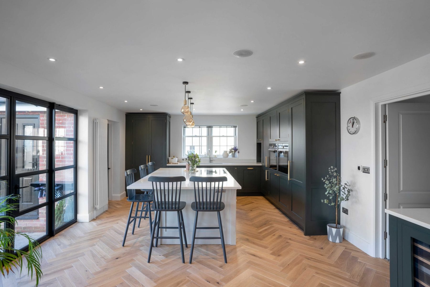 CUSTOM DARK SHAKER KITCHEN WITH OAK PARQUET FLOORING