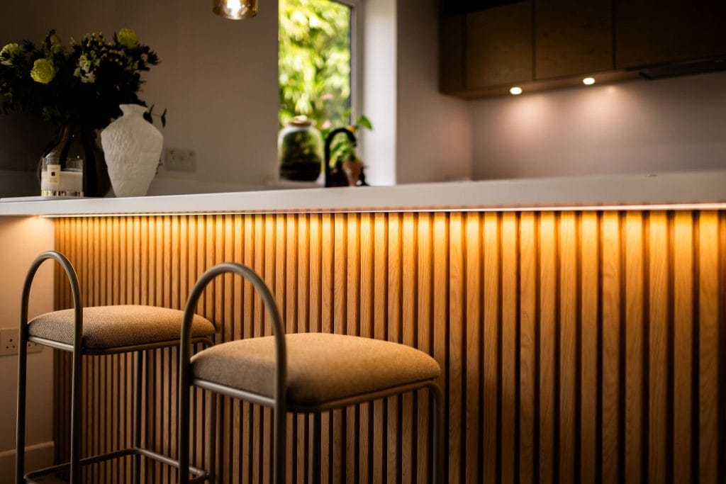 Oak acoustic panelled breakfast bar in kitchen
