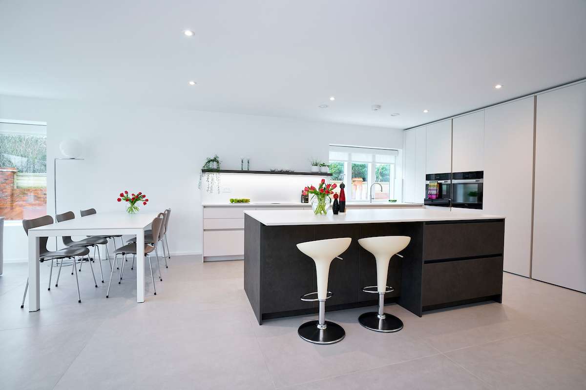 sleek contemporary kitchen design with marble-effect quartz worktop and soft grey cabinetry